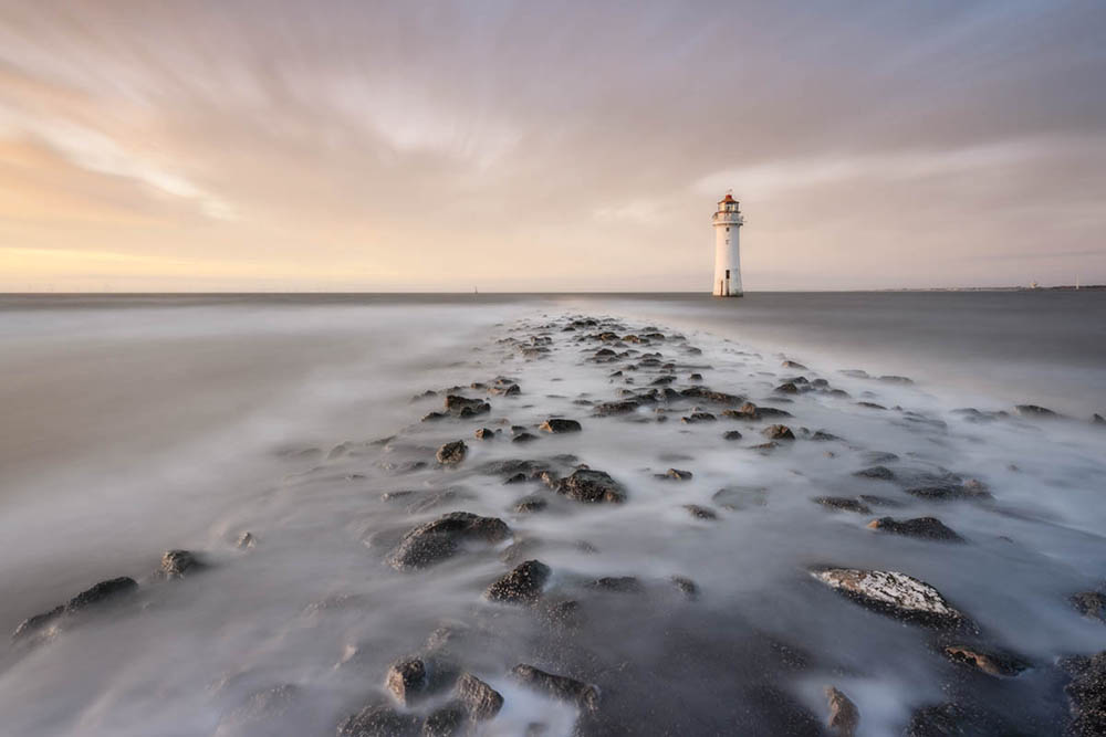 New Brighton Lighthouse at New Brighton Beach, Wallasey on the Wirral at sunset