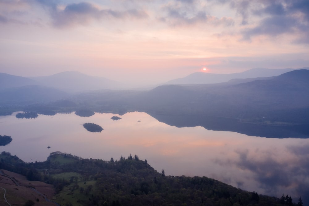 Overlooking Derwent Water from Cat Bells during a hazy sunrise and shot on the DJI Mavic 2 Pro