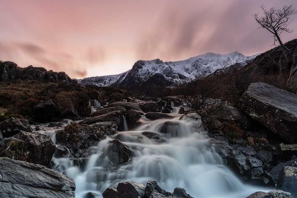 Cwm Idwal waterfall, in Snowdonia North Wales, at sunset in winter edited with the Orton effect