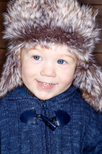 Toddler wearing a furry winter hat